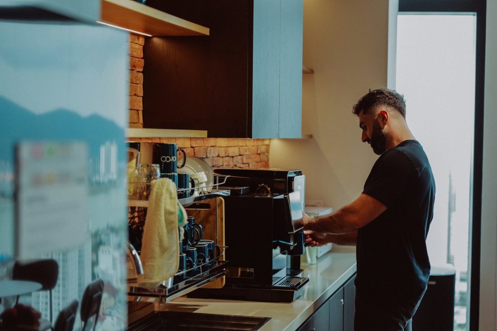 Man making coffee during morning routine