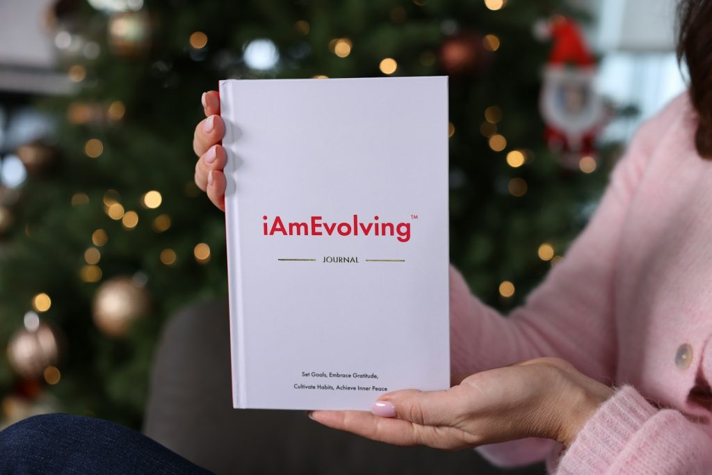 Person holding a journal for personal growth and habit building