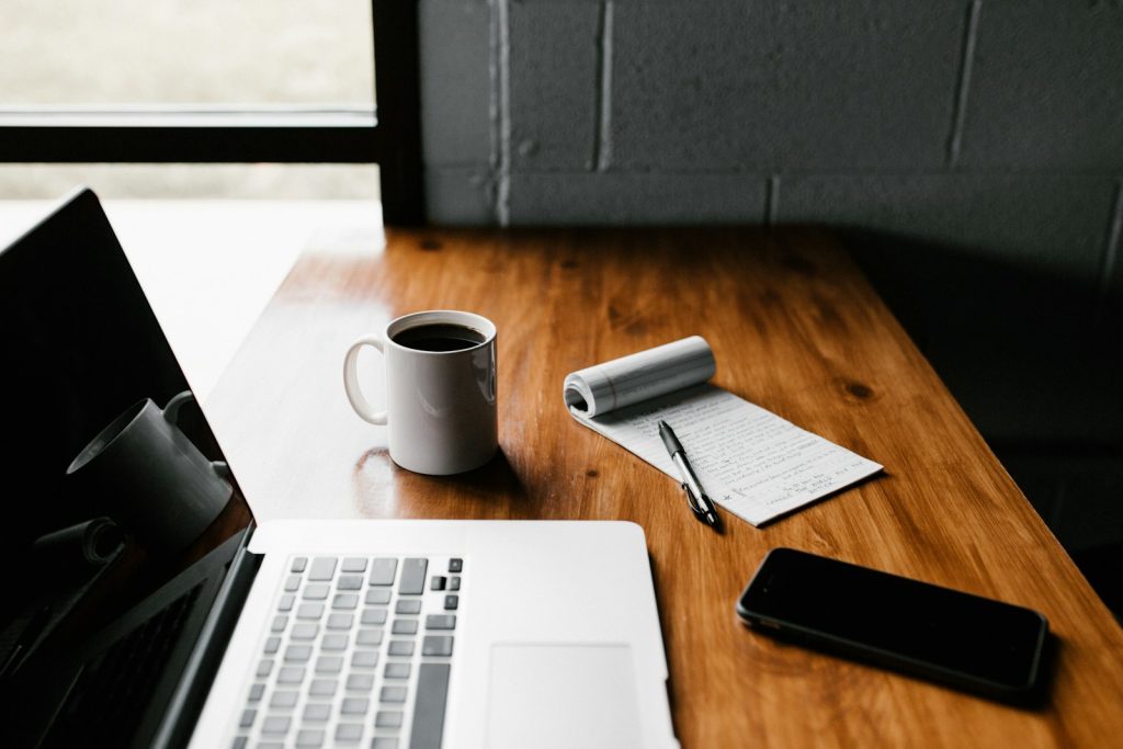 A quiet desk with a notebook prepared for a calm weekly reset