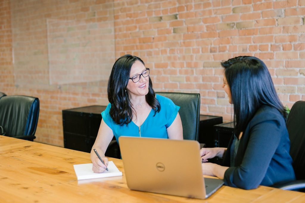 Candidate preparing calmly before a job interview with notes on a desk
